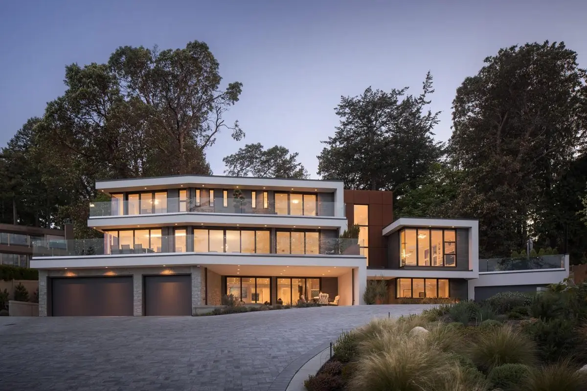Modern house above the water at dusk